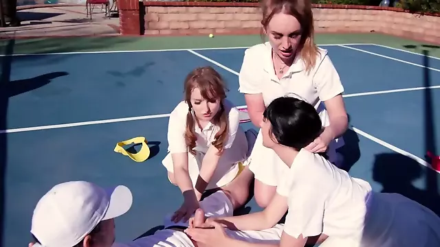 Female tennis players work as a team during outdoor threesome sex