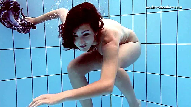 Sensual dark-haired beauty Sima Lastova enjoys an underwater adventure