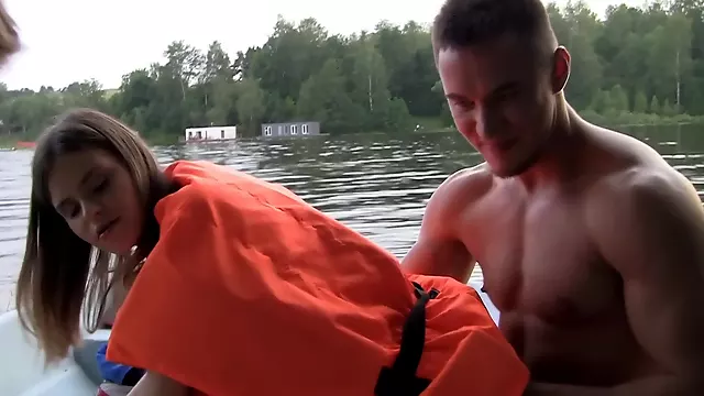 Hardcore on a boat with a cutie in a life vest